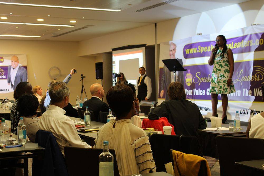 Annie Ka speaking to an audience